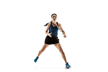 Fototapeta na wymiar Full length portrait of young woman playing tennis isolated on white background. Healthy lifestyle. The practicing, fitness, sport, exercise concept. The female model in motion or movement