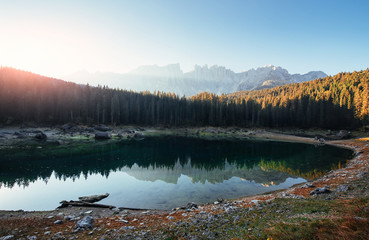 No people, only pure beauty of nature. Autumn landscape with clear lake, fir forest and majestic mountains