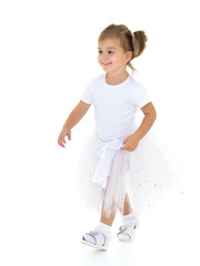 The little girl is walking fast.