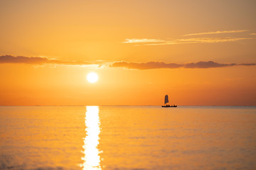 (石垣島)夕焼けの海と船