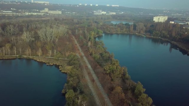 Aerial footage over Echo Park Lake, Kishinev, Moldova republic of. View of lake and smille bridge.