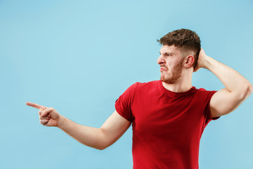 Ew. It's so gross. Young man with disgusted expression repulsing something. Disgust concept. Young...