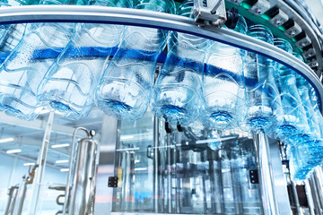 A closeup of a robotic mineral water production line