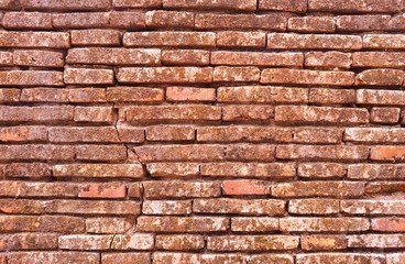 old red brick wall from ruins in thailand background
