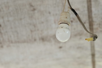 Closed Up old lamp with repaired electrical wired line with brown background