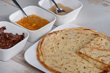 delicious pancakes with chocolate sugar and jam