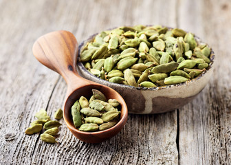 Cardamom beans on wooden board