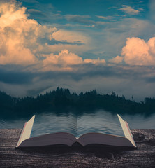 Sunset clouds over the lake on the pages of book