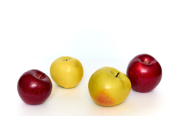 red and yellow apples on white background