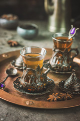 Turkish tea in traditional glass on tray closeup