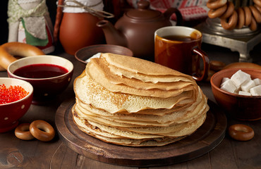 Shrovetide Maslenitsa Butter Week festival meal. Stack of russian pancakes blini