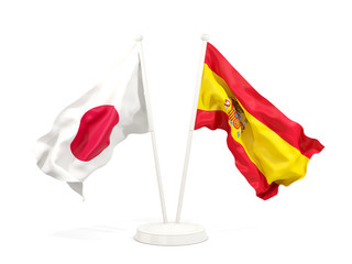 Two waving flags of Japan and spain