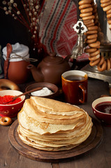 Shrovetide Maslenitsa Butter Week festival meal. Stack of russian pancakes blini