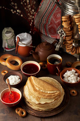Shrovetide Maslenitsa Butter Week festival meal. Stack of russian pancakes blini