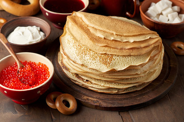 Shrovetide Maslenitsa Butter Week festival meal. Stack of russian pancakes blini