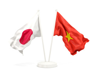 Two waving flags of Japan and vietnam