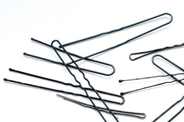 hairpins scattered on a white background