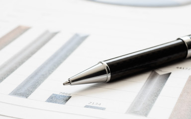 Naklejka premium Close-up pen on financial report. Concept of Infomation Data Analysis, Business Investment Analytics and Business Planning. Web Banner.