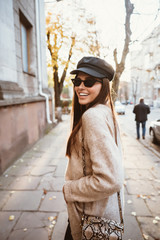 Street portrait of young beautiful fashionable woman