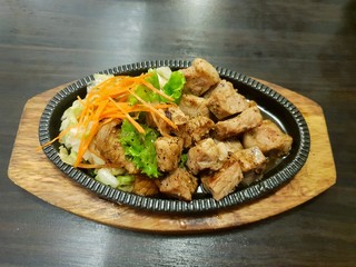 Japanese food style, Top view of buta steak with fried carrot, lettuce, cabbage on the table at restaurant, Space for text in template