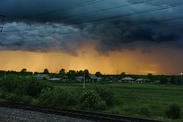 storm sky over the village in summer