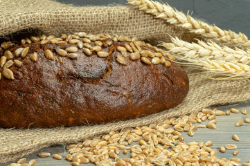 Bread with sunflowers on rustic wooden table