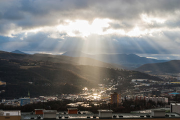 Fototapeta premium Cityscape panorama with sky heaven light sun rays, Usti nad Labem, Czech republic