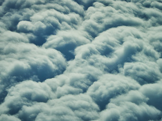Clouds as viewed out the window of an airplane
