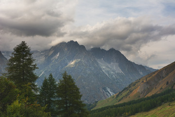 A hiking trip with a backpack of alpine mountains.