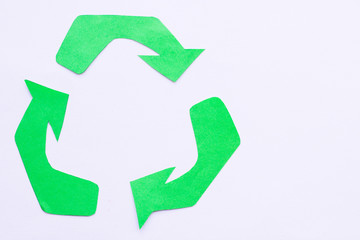 Obraz premium Environmental protection, ecology and recycling concept, recycle sign, notepad and garbage on white background