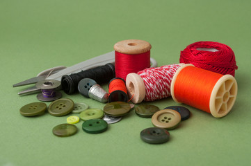closeup of sewing set on green background