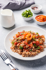 Buckwheat porridge with canned tomato and pepper.