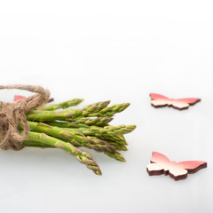 Bunch of asparagus tied with rope, butterflies
