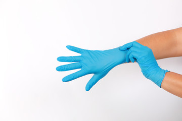 Human wearing glove on white background.	
