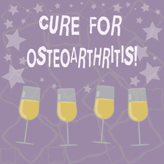 Writing note showing Cure For Osteoarthritis. Business photo showcasing Treatment for the pain and stiffness of joints Filled Cocktail Wine Glasses with Scattered Stars as Confetti Stemware