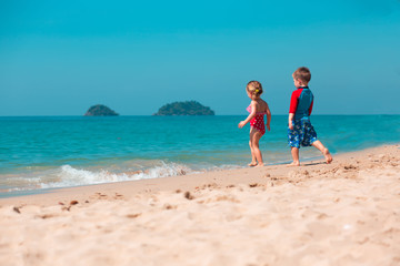 Little girl and boy on the beach, Koh Chang island