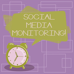 Text sign showing Social Media Monitoring. Conceptual photo way of computing popularity of a brand online Blank Rectangular Color Speech Bubble Overlay and Analog Alarm Clock