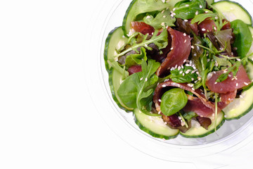 Fresh salad from greens and ham