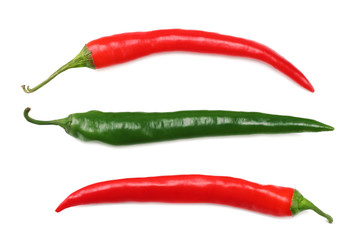 green and red hot chili peppers isolated on white background. top view