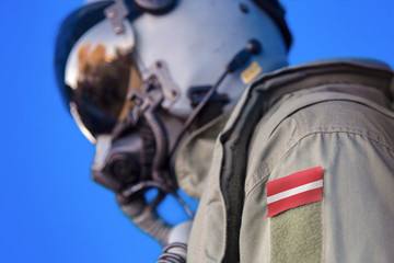 Air force pilot flight suit uniform with Latvia flag patch. Military jet aircraft pilot	