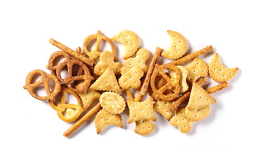 Salty cracker pretzel party mix isolated on white background, top view