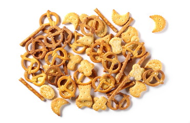 Salty cracker pretzel party mix isolated on white background, top view