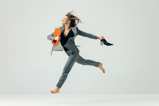 Happy Business Woman Dancing And Smiling In Motion Isolated Over White Studio Background. Human Emotions Concept. The Businesswoman, Office, Success, Professional, , Happiness, Expression Concepts