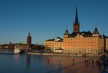 Naklejka na ściany i meble Bridges and frozen lakes at the waterfront in Stockholm a Sunny Winter Day