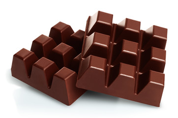 Dark chocolate pieces isolated on white background