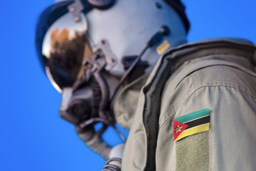 Obraz premium Air force pilot flight suit uniform with Mozambique flag patch. Military jet aircraft pilot 