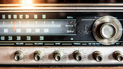 Retro old radio dashboard with rustic tuning button. Listen to music and news from broadcasting. Vintage lifestyle concept