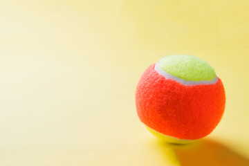 Tennis Ball on yellow Background, Sport Concept and Idea, © Elenglush