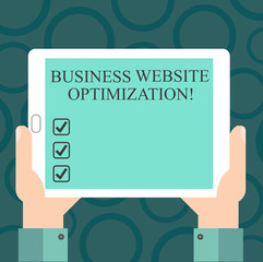 Writing note showing Business Website Optimization. Business photo showcasing Boost and improve Search Engine Visibility Hu analysis Hand Holding Tablet Smartphone Display Unit photo