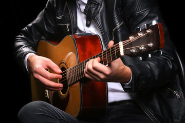 Young men playing the guitar